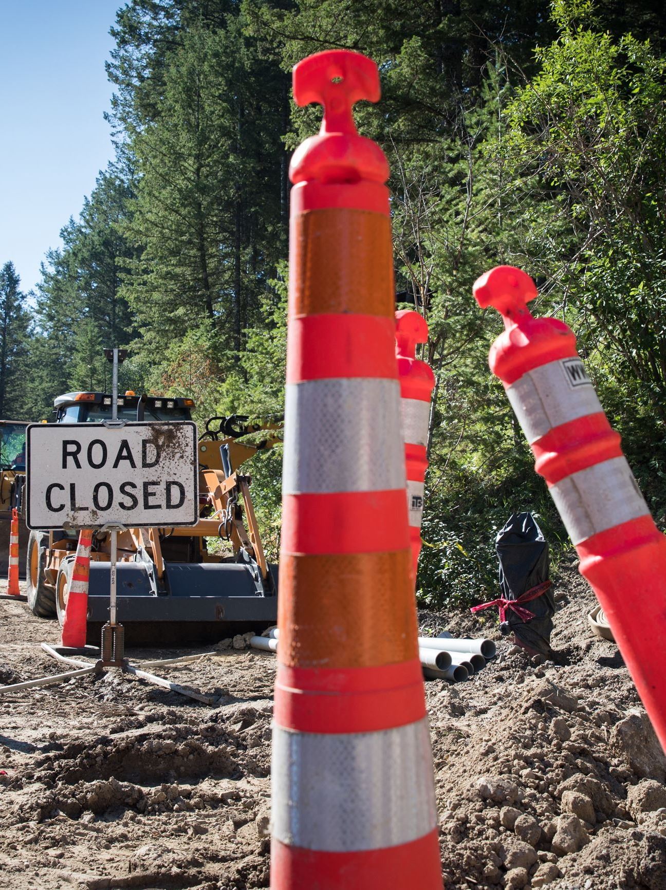 Construction cones and road closed sign
