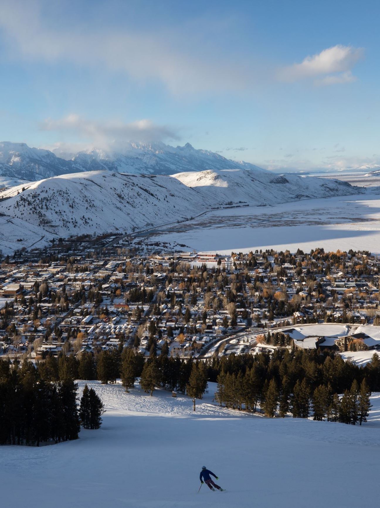 Snow King winter with skier looking toward grand