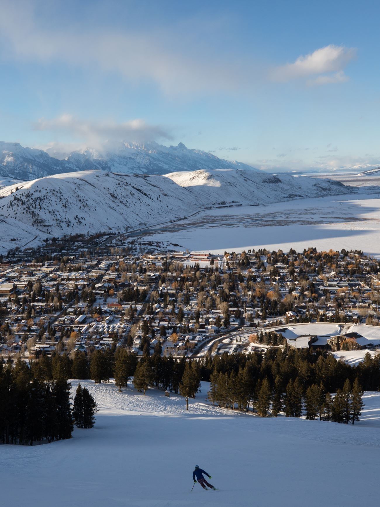 Snow King winter with skier looking toward grand