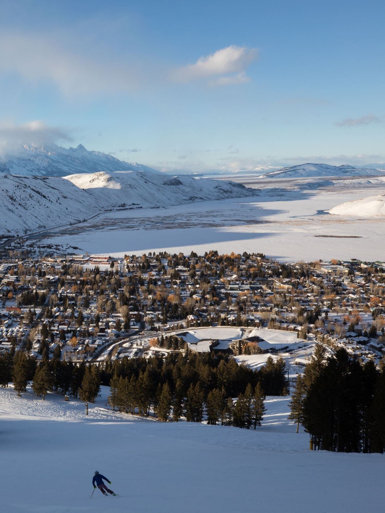 Snow King winter with skier looking toward grand