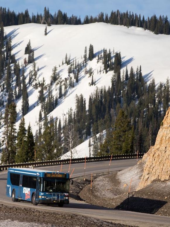 START BUS coming down Teton Pass BIG VIEW