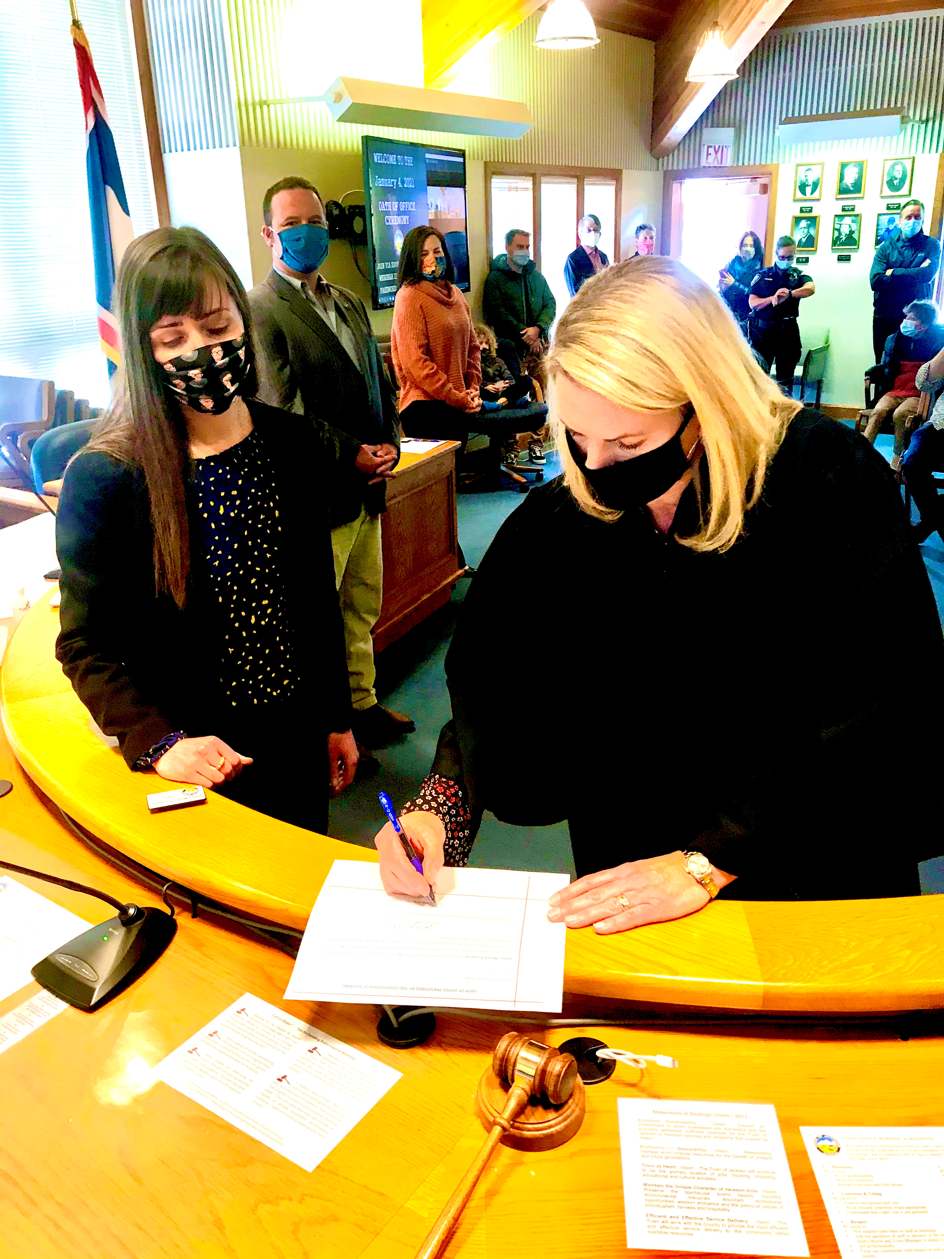 Melissa and Judge sign certificate