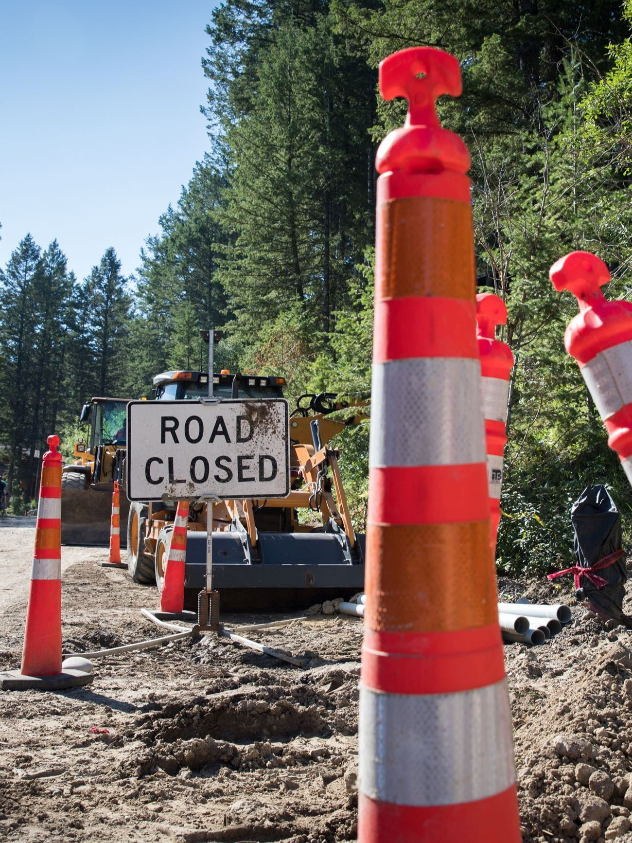 Construction cones and road closed sign